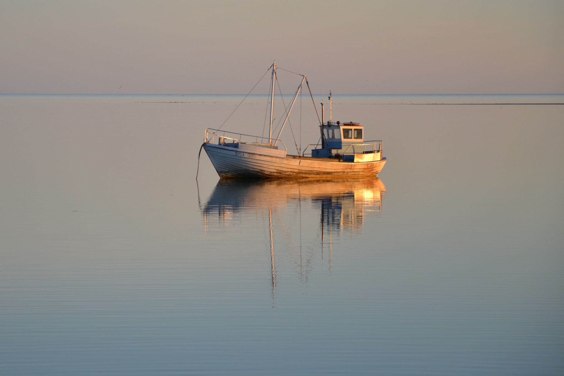 Visit Saaremaa - paat päikeseloojangus